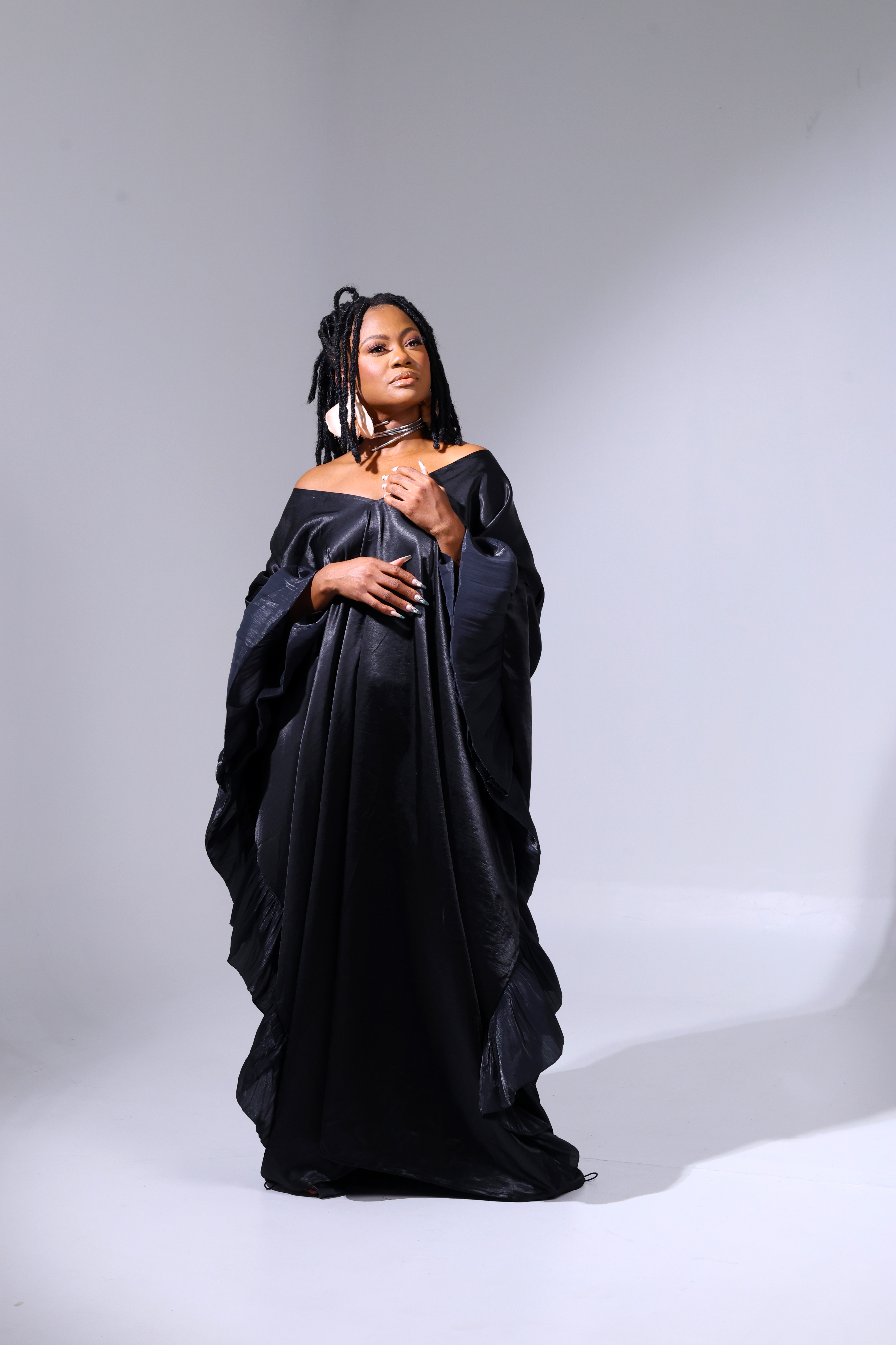 Studio portrait in a black gown